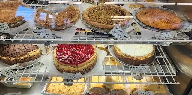 bakery case at barry's with new york style chessecake