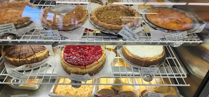 bakery case at barry's with new york style chessecake