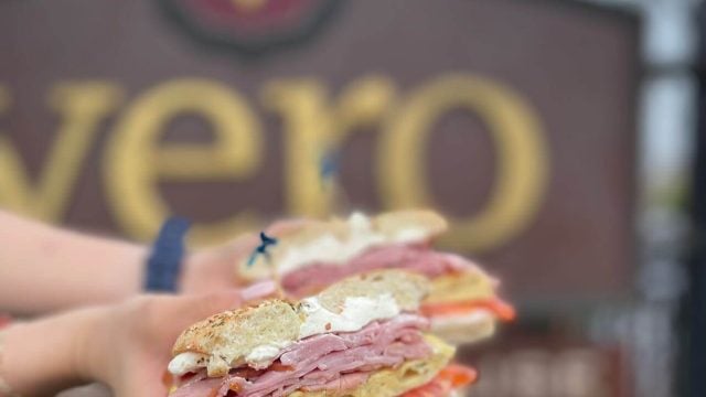 hands hold a sandwich at vero espresso
